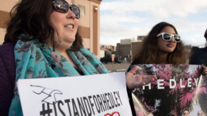 Hedley fans Valerie Rivet, left to right, Charene Gonschorek and Brandon Krys show their support for the band before the final concert of their current tour in Kelowna, B.C., on Friday, March 23, 2018. The band's tour has been overshadowed by allegations of sexual misconduct. The band was dropped from their management company, The Feldman Agency, their songs were pulled from radio stations across the country and a planned performance at the Juno Awards was cancelled. Following the tour, Hedley has announced that they will be taking an indefinite hiatus from music.