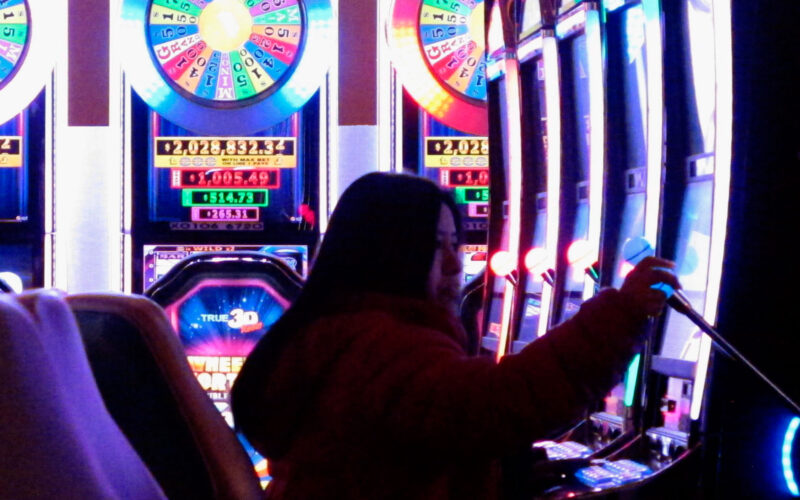 This Jan. 31, 2018 photo shows a gambler playing a slot machine at the Tropicana Casino and resort in Atlantic City N.J. Atlantic City's seven casinos saw their gross operating profits increase by 22.5 percent last year, to $723 million.